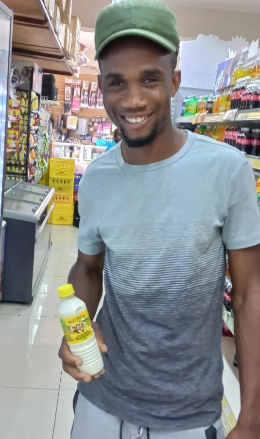 Customer holding FORGE bottle in store